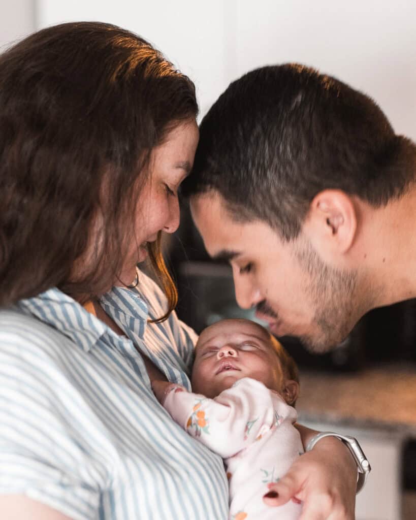 Emotional in-home family lifestyle portrait with newborn by Tony Porter Photography & Films